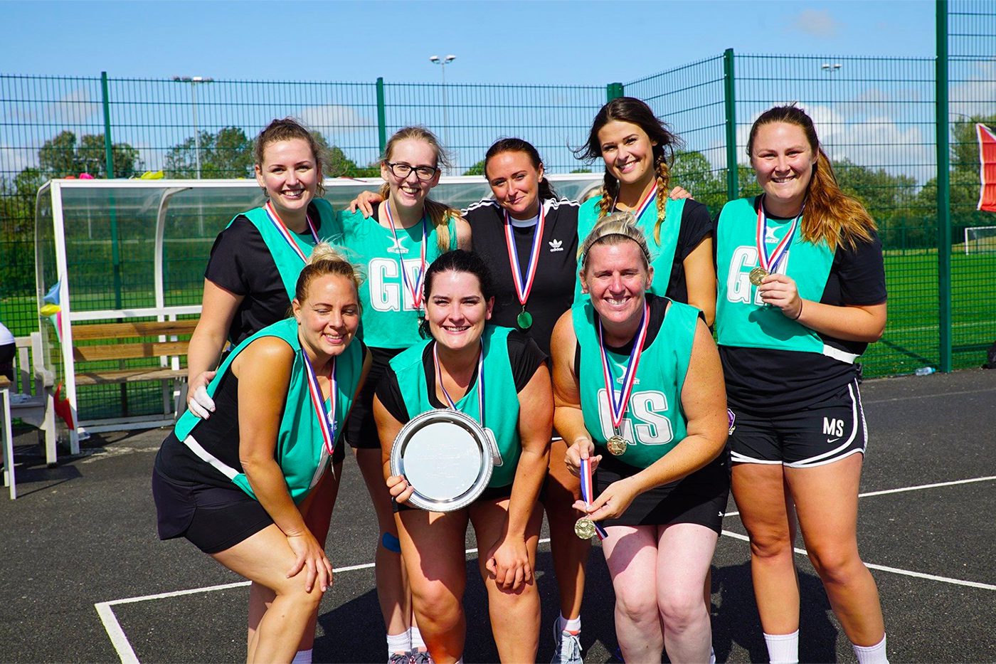 Image of netball team holding their awards